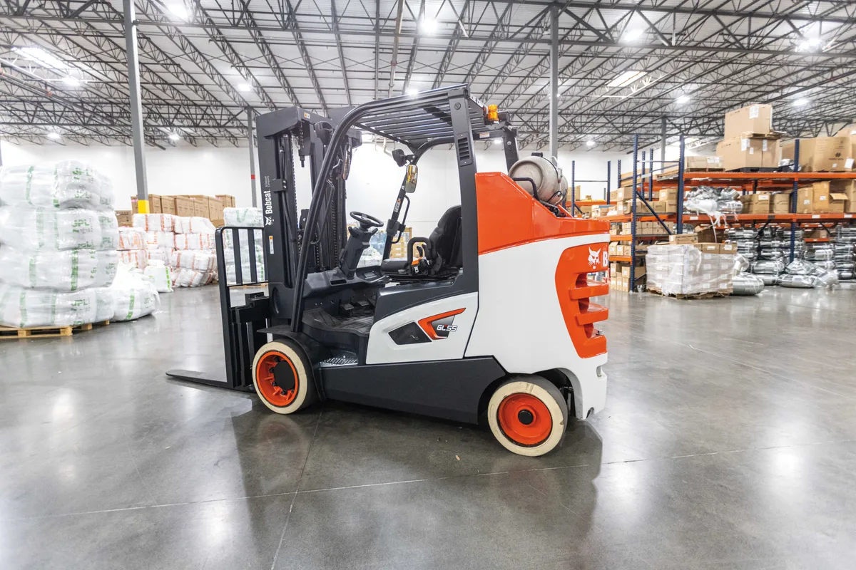 Cushion-tire forklift working a smooth indoor warehouse floor
